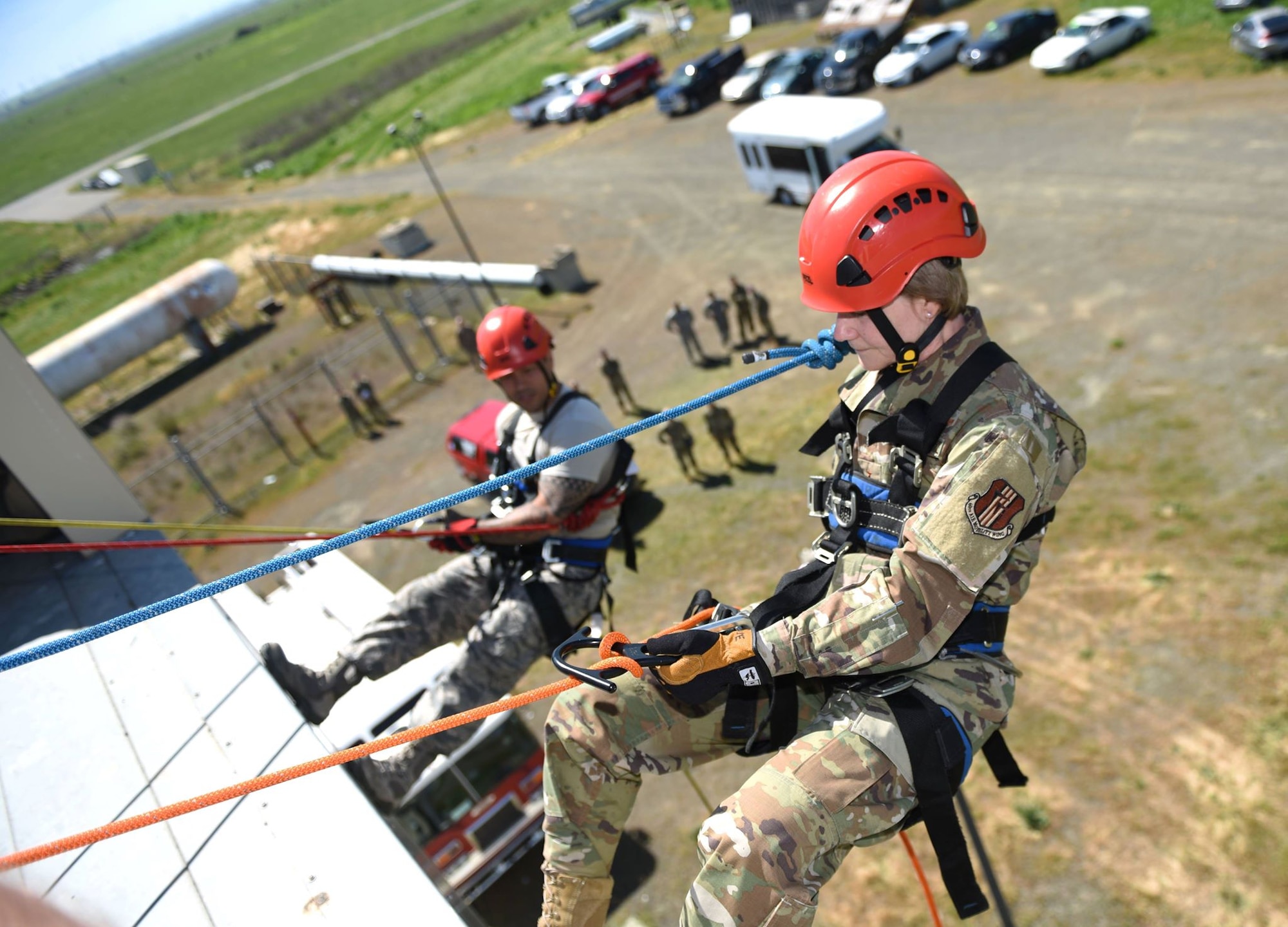 Gen. Maryanne Miller, Air Mobility Command commander, rappels down a building with the help of the 60th Civil Engineer Squadron as part of a tour of Travis Air Force Base, California, April 18, 2019. The tour served to highlight the relationship Travis’ major command has with its bases’ Airmen while also working to inspire innovative efforts among its respective squadrons. (U.S. Air Force photo by Airman 1st Class Christian Conrad)