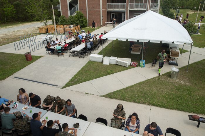 U.S. Marines with Combat Logistics Regiment 27, 2nd Marine Logistics Group, play volleyball during a barracks bash on Camp Lejeune, North Carolina, April 18, 2019. The purpose of the barracks bash was to celebrate completed barracks renovations, strengthen cohesion, foster a positive atmosphere and enhance the quality of life for Marines and Sailors. (U.S. Marine Corps photo by Cpl. Damion Hatch Jr)