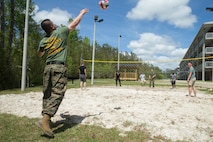 U.S. Marines with Combat Logistics Regiment 27, 2nd Marine Logistics Group, play volleyball during a barracks bash on Camp Lejeune, North Carolina, April 18, 2019. The purpose of the barracks bash was to celebrate completed barracks renovations, strengthen cohesion, foster a positive atmosphere and enhance the quality of life for Marines and Sailors. (U.S. Marine Corps photo by Cpl. Damion Hatch Jr)