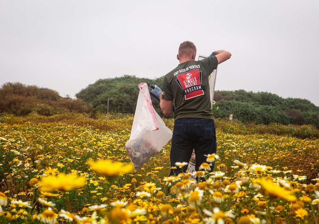Marines from Marine Corps Air Station Miramar clean and restore Fiesta Island in San Diego, April 24. The Marines came together for the Single Marine Program’s 5th annual “Days of Service” event, which involves Marines going to different locations off of the installation and doing their part in keeping the environment clean. (U.S. Marine Corps photo by Sgt. Becky Cleveland)