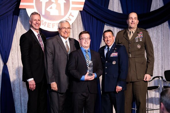 Benjamin Rawald poses with U.S. Air Force Brig. Gen. (ret.) John I. Pray, Jr., President and CEO, Operation Homefront, U.S. Army Maj. Gen. (ret.) Lee Baxter, Board of Directors Chairman, Operation Homefront, Air Force Lt. Gen. Brian Kelly, Deputy Chief of Staff for Manpower, Personnel and Services and U.S. Marine Corps Lt. Gen. Daniel O’Donohue, Director, Joint Force Development, J7. Benjamin Rawald, from Del Rio, Texas, was named the 2019 Air Force Military Child of the Year Award, and he hopes to be a role model for all Air Force kids. (Courtesy photo)