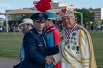 Col. Jason Janaros, 37th Training Wing commander, presents a Fiesta medal to 2019 Fiesta Royalty, Sal Barbaro as the celebrated El Rey Feo LXXI, April 19, 2019, at Joint Base San Antonio-Lackland, Texas.