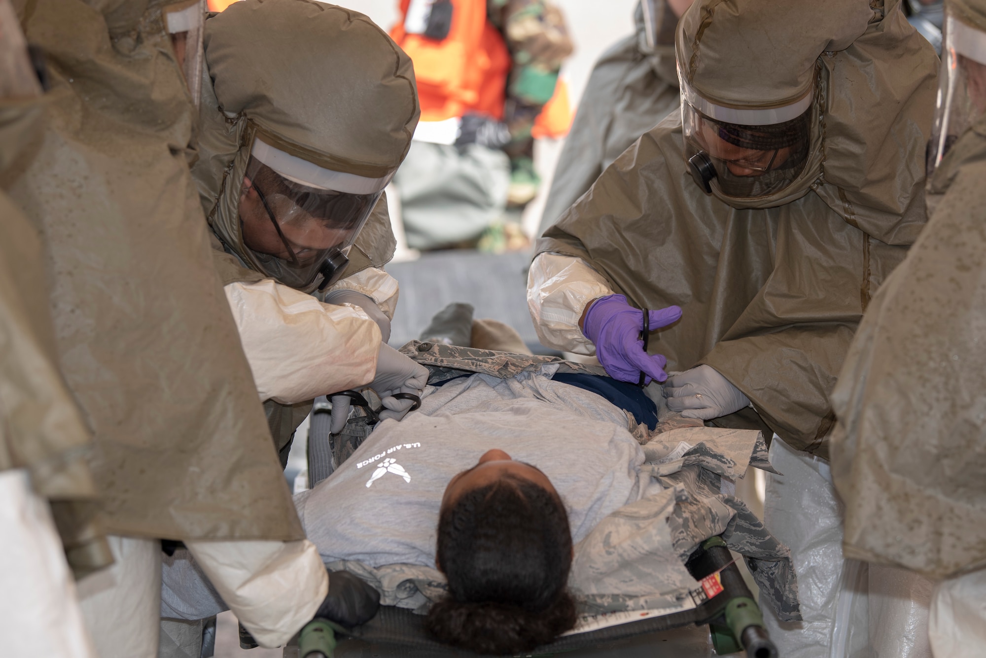U.S. Air Force 52nd Medical Group personnel perform decontamination procedures on a mock victim during a week-long base readiness exercise at Spangdahlem Air Base, Germany, April 17, 2019. Exercise victims are decontaminated and moved to the medical building for more hands-on treatment. (U.S. Air Force photo by Airman 1st Class Branden Rae)