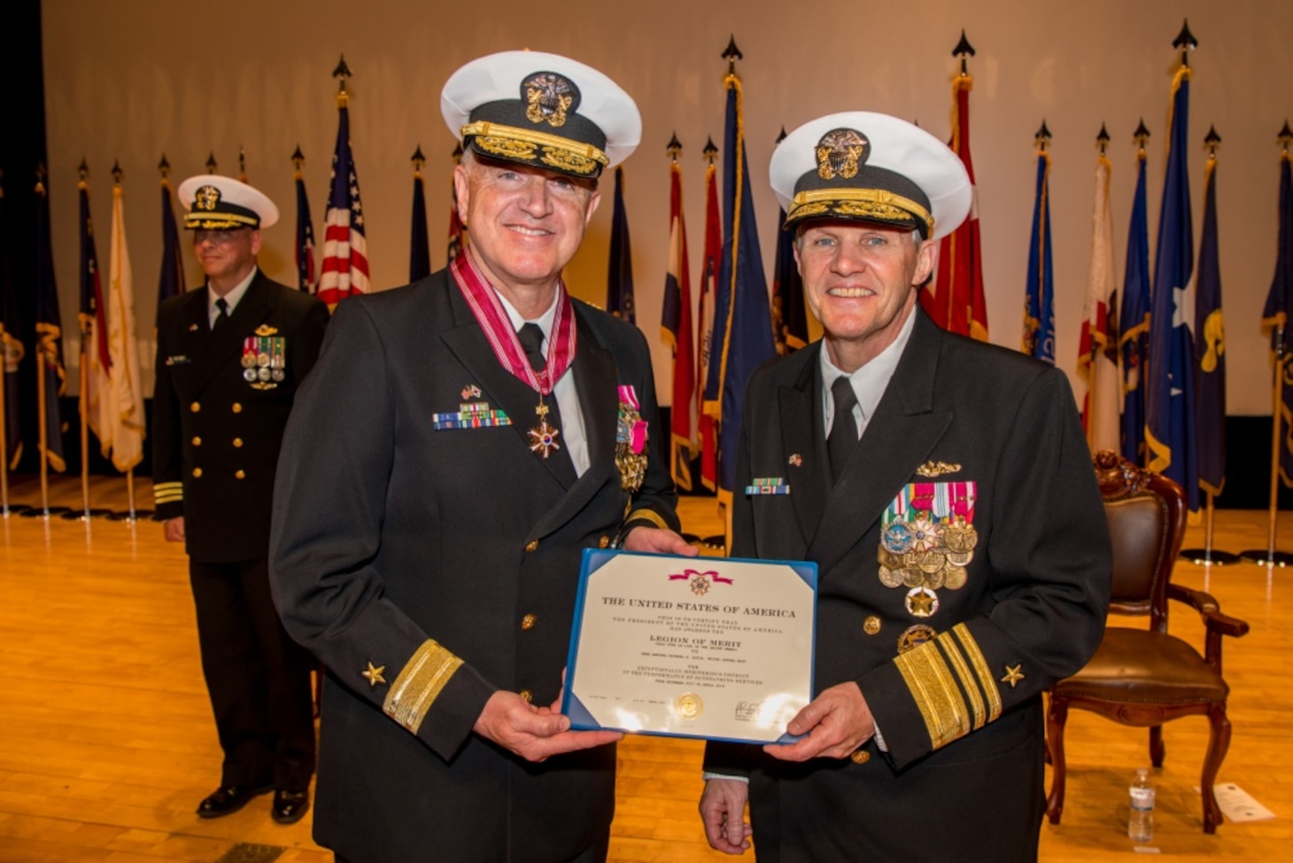 190425-N-TB148-0096 BUSAN, Republic of Korea (April 25, 2019) Vice Adm. Phil J. Sawyer, commander, U.S. 7th Fleet, presents Rear Adm. Michael E. Boyle, commander, U.S. Naval Forces Korea (CNFK), the Legion of Merit during a change of command ceremony aboard the Republic of Korea (ROK) Fleet base in Busan. During the ceremony, Rear Adm. Michael P. Donnelly relieved Boyle to become the 37th CNFK.