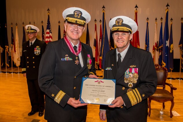 190425-N-TB148-0096 BUSAN, Republic of Korea (April 25, 2019) Vice Adm. Phil J. Sawyer, commander, U.S. 7th Fleet, presents Rear Adm. Michael E. Boyle, commander, U.S. Naval Forces Korea (CNFK), the Legion of Merit during a change of command ceremony aboard the Republic of Korea (ROK) Fleet base in Busan. During the ceremony, Rear Adm. Michael P. Donnelly relieved Boyle to become the 37th CNFK.