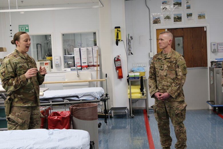 An overview of the Trauma Bay is given to Command Sergeant Major Brad Houston during a Path of the Patient tour at Bagram Airfield.