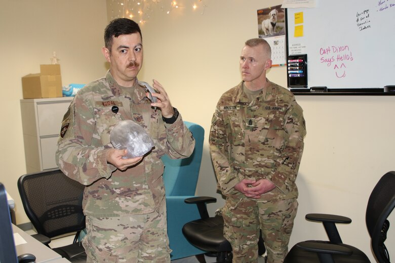 Inside the radiology department Command Sergeant Major Brad Houston gets a briefing about some of the great medical abilities used in maintaining patient stability.