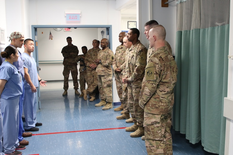 Intensive Care Unit staff at Craig Joint Theater Hospital give an overview of services and protocols to members of the USACE Afghanistan District and the Command Sergeant Major of USACE Brad Houston as they continue their tour of the Path of the Patient.