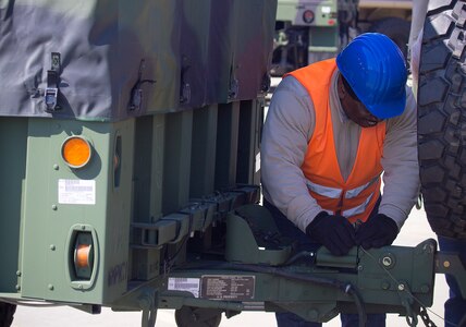 David Gaddy, Quality Assurance Specialist, Army Field Support Battalion-Mannheim examines a trailer as part of the battalion’s quality assurance process at Coleman Work Site, Germany, April 4.