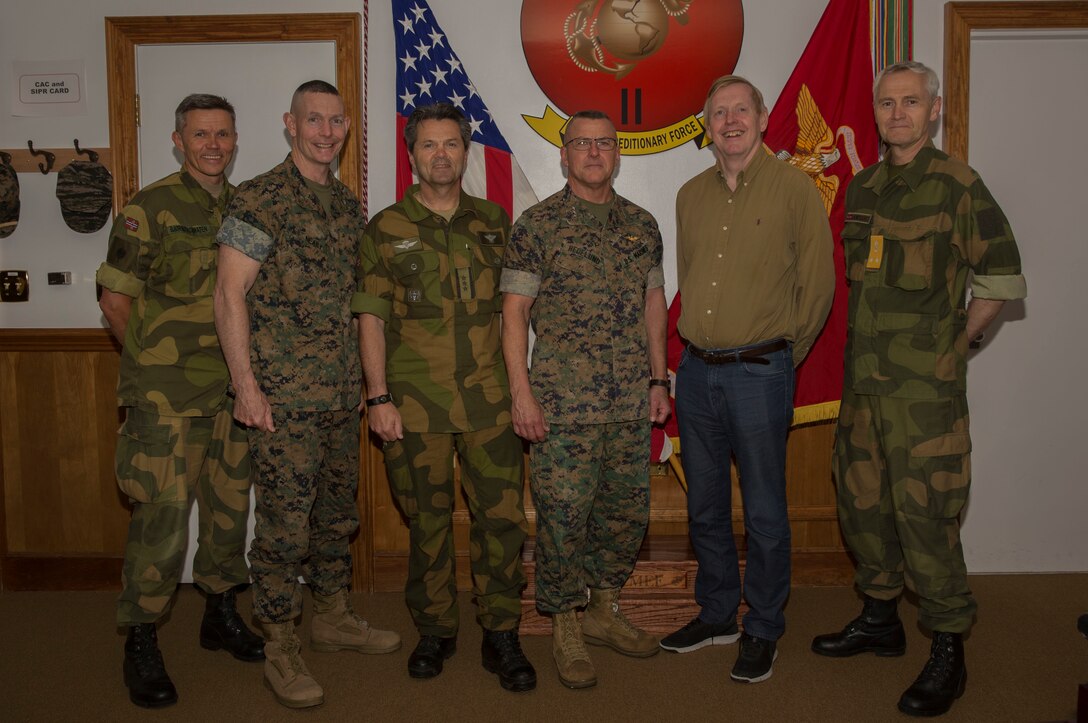 From left to right; Norwegian Army Lt. Col. Per-Erik Bjøernstadbråten, Norwegian liaison to the Marines, Brig. Gen. Stephen M. Neary, 2nd Marine Expeditionary Brigade commanding general, Col. Magne Rodahl, Norwegian military attaché, Lt. Gen. Robert F. Hedelund, II Marine Expeditionary Force commanding general, Norwegian Ambassador Kåre R. Aas and Rear Adm. Ole M. Sandquist, Norwegian defense attaché pose for a group photo during the ambassador’s visit to Camp Lejeune N.C., April 23, 2019. The ambassador came to Camp Lejeune and Marine Corps Air Station New River to learn more about II Marine Expeditionary Force and to get a better idea on how the relationship between the Marines and Norwegians can continue to develop. The ambassador also met with Lt. Gen. Robert F. Hedelund, the II MEF commanding general, to discuss future training opportunities between Marines and the Norwegian Army. (U.S. Marine Corps photo by Cpl. Leynard Kyle Plazo)