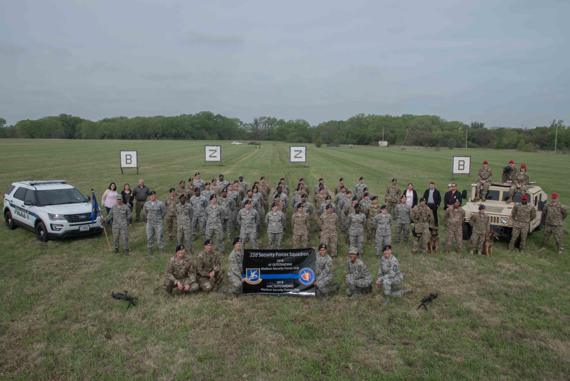 The 22nd Security Forces Squadron poses for a photoApril 24, 2019, at McConnell Air Force Base, Kan. The 22nd SFS achieved the Best Medium Unit Award in not only the Air Mobility Command, but also the Air Force. (U.S. Air Force photo by Airman 1st Class Alan Ricker)