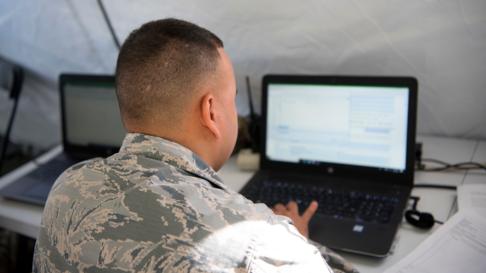 U.S. Air Force Staff Sgt. Felix Castro, a contract specialist with the 6th Contracting Squadron, digitally signs a simulated contract during the Operation Open Horizon training exercise April 16, 2019, at MacDill Air Force Base, Fla. The 6th Contracting Squadron partnered with the 6th Comptroller Squadron to expose Airmen to the unique duty requirements of providing contracting and pay agent support in a deployed environment.