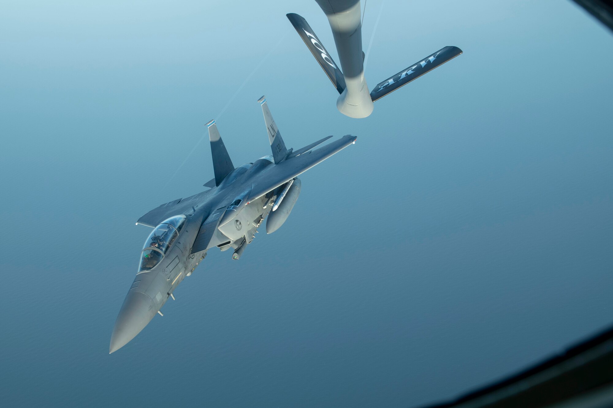 An F-15E Strike Eagle assigned to the 48th Fighter Wing at RAF Lakenheath, England, breaks away from a 351st Air Refueling Squadron KC-135 Stratotanker at RAF Mildenhall during the “FURIOUS 48” readiness exercise over the skies of England, April, 24, 2019. The exercise was designed to emphasize the importance of combat skills effectiveness training and test 100th ARW and 48th FW Airmen on their ability to survive and operate in wartime conditions. (U.S. Air Force photo by Senior Airman Luke Milano)