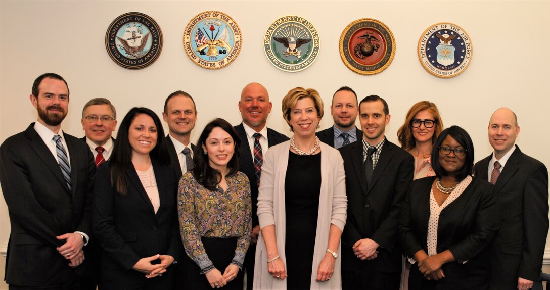 The Honorable Ellen M. Lord smiles for a photo with DOD Public-Private Talent Exchange program participants.