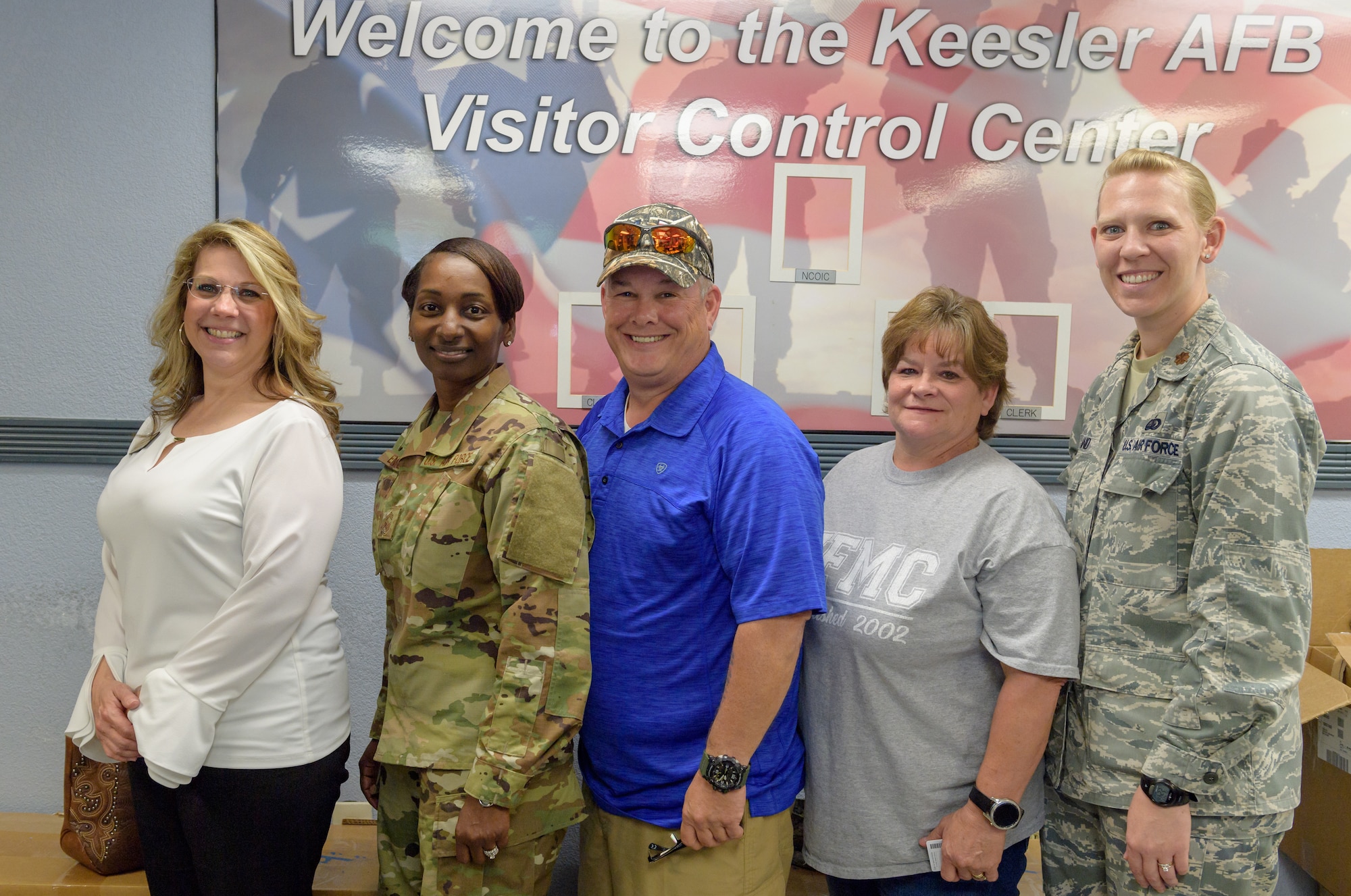 81st Force Support Squadron leadership and an Airman and Family Readiness Center representative pose for a photo with Air Force Family Forever Members Michael and Donna “Denise” Bradford, parents of Airman 1st Class Brian Bradford, inside the visitor center at Keesler Air Force Base, Mississippi, Apr. 23, 2019.  As surviving parents of a service member, Michael and Donna obtained an ID card for recognition and installation access so they can attend events and access A&FRC referral services. (U.S. Air Force Photo by Andre' Askew)