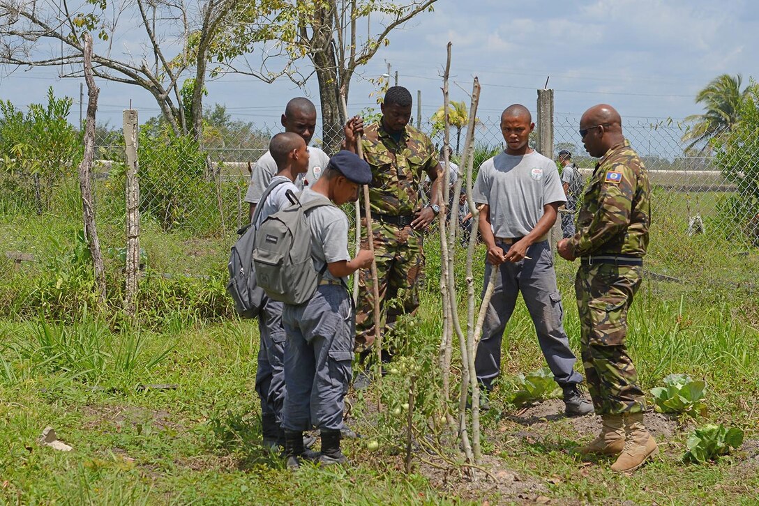 Belize Youth Challenge Program cadre mentor YCP cadets during the agriculture class at the Belize YCP near Belize City, Belize. The Belize YCP is a two-phase program designed to teach 15-17 year old at risk males how to be productive members of their communities. The program in Belize is modeled after the Louisiana National Guard's YCP.