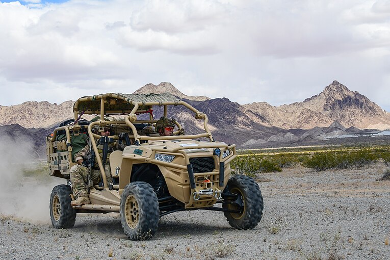 Airmen conduct exercise scenarios in a vehicle.