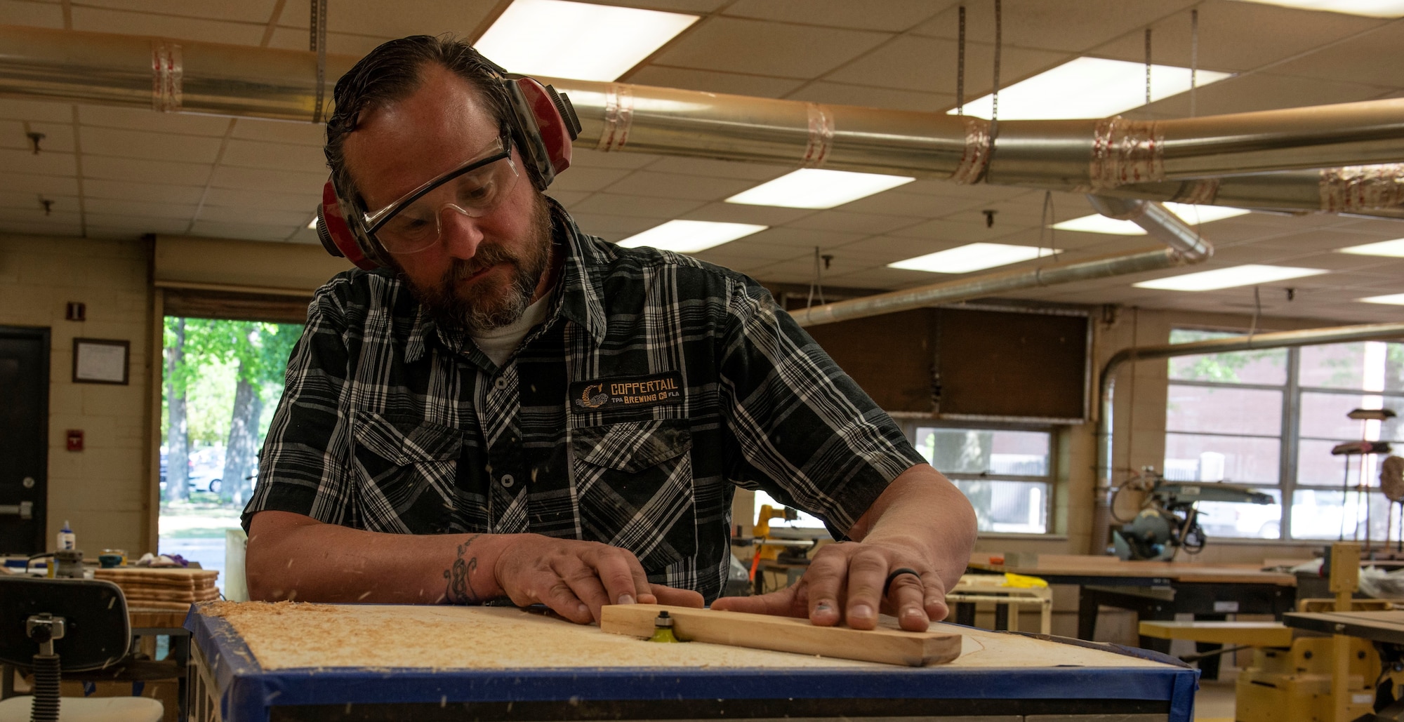 Mr. Ivan Johnson, 20th Force Support Squadron (FSS) Woodworking Shop instructor cuts down a piece of wood, at Shaw Air Force Base, S.C., April 17, 2019. The 20th FSS Woodworking Shop is open in the Arts and Crafts center, from 8 a.m. – 4 p.m., for all base members to special order or construct their own wood projects.