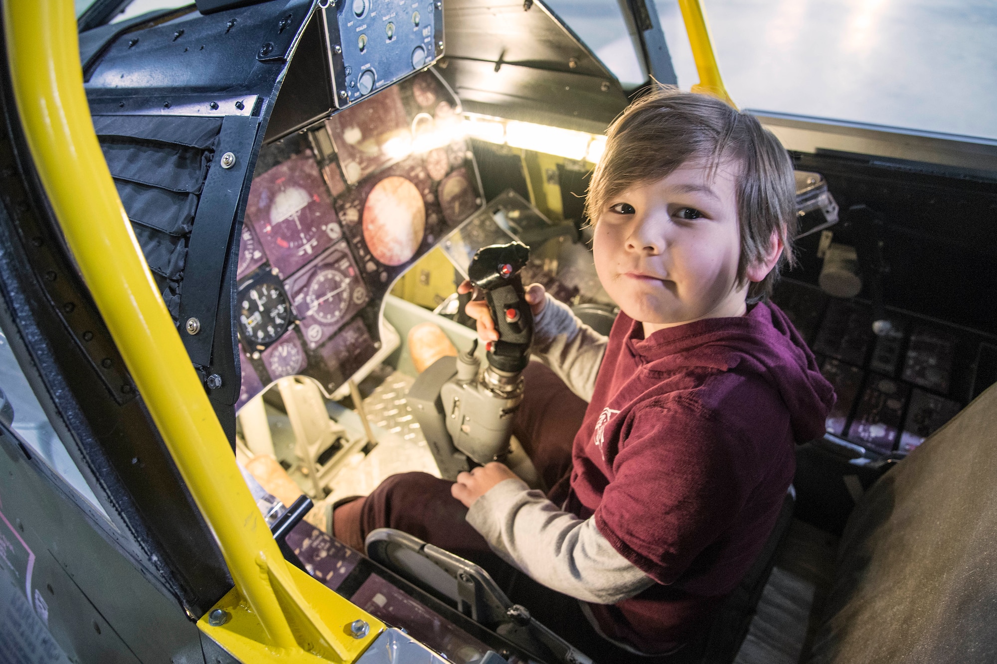 DAYTON, Ohio - A museum visitor enjoying the A-7D Sit-in Cockpit in the Cold War Gallery at the National Museum of the U.S. Air Force. (U.S. Air Force photo)