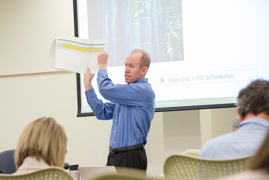 Bob Slattery, a program manager at the Department of Energy's Oak Ridge National Laboratory (Engineering Science and Technology Division) in Oak Ridge, Tennessee, leads members of the U.S. Army Engineering and Support Center, Huntsville, through an exercise on the topic of Energy Savings Performance Contracting in Huntsville, Alabama, March 28, 2019, as part of a three-day refresher class.