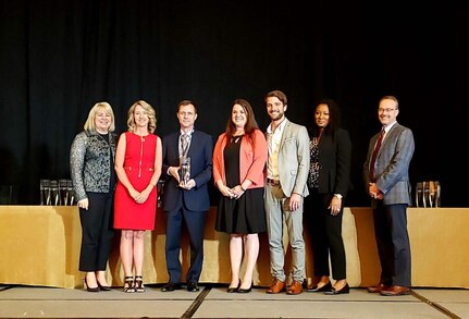 Photo from left to right:  Jackie Kerby Moore, Vice Chair, FLC; Brooke Pyne, NSWC Crane; Bruce Floersheim, PhD, GoX Studio; Jenna Dix, NSWC Crane; Austin Leach, PhD, TechLink; Kendra Meggett-Carr, Office of Naval Research; and John Dement, FLC Chair.