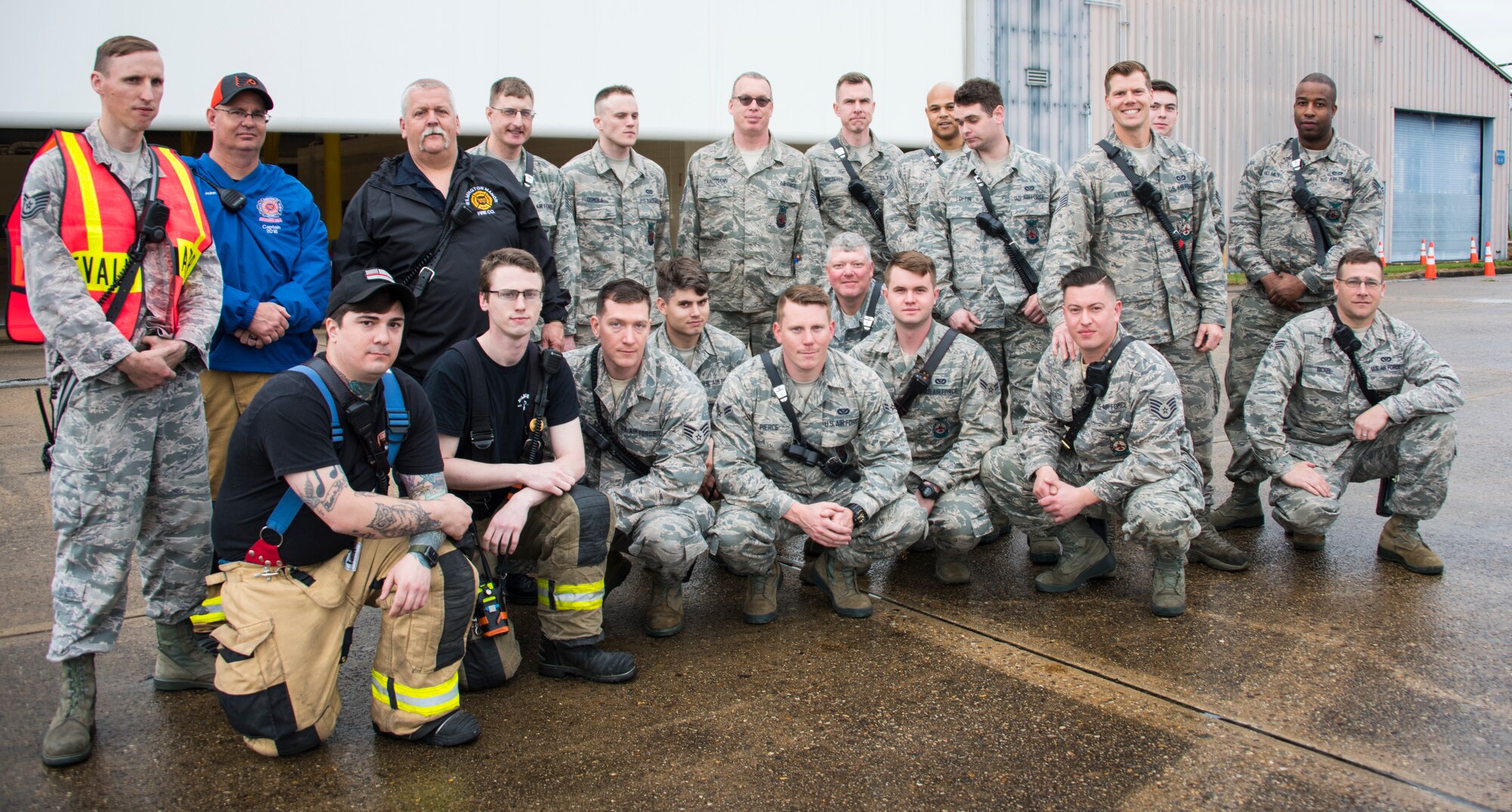 166th Civil Engineer Squadron firefighters pose for a group photo with Wilmington Manor Fire Company Director Bernie Nutter II prior to the start of Operation Blue Skywalker, April 10, 2019 at Delaware National Guard Base, Del. 166th CES firefighters worked in coordination with the Wilmington Manor Fire Company. (U.S. Air Force photo by Mr. Mitch Topal)