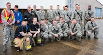 166th Civil Engineer Squadron firefighters pose for a group photo with Wilmington Manor Fire Company Director Bernie Nutter II prior to the start of Operation Blue Skywalker, April 10, 2019 at Delaware National Guard Base, Del. 166th CES firefighters worked in coordination with the Wilmington Manor Fire Company. (U.S. Air Force photo by Mr. Mitch Topal)