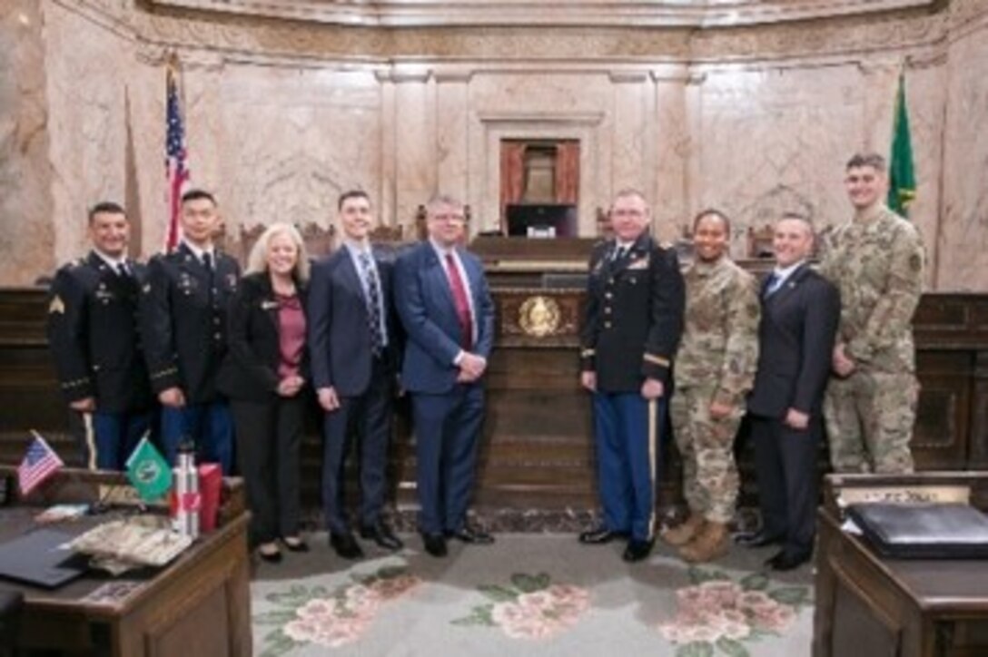 Washington State Representative Jeremie Dufault, who is also an Army Reserve Officer with the 364th Sustainment Command (Expeditionary), and members of the House of Representatives, hosted a brief ceremony at the State Capitol in Olympia, where they presented a 'Letter of Recognition' honoring the Army Reserve on its 111th anniversary to Army Reserve Ambassador Mr. Kurt Harding, Mr. Herold Hudson, Command Executive Officer and representative for Commanding General Brig. Gen. Vincent E. Buggs, and Col. Kyle Myers, Chief of Operations for the 364th ESC.