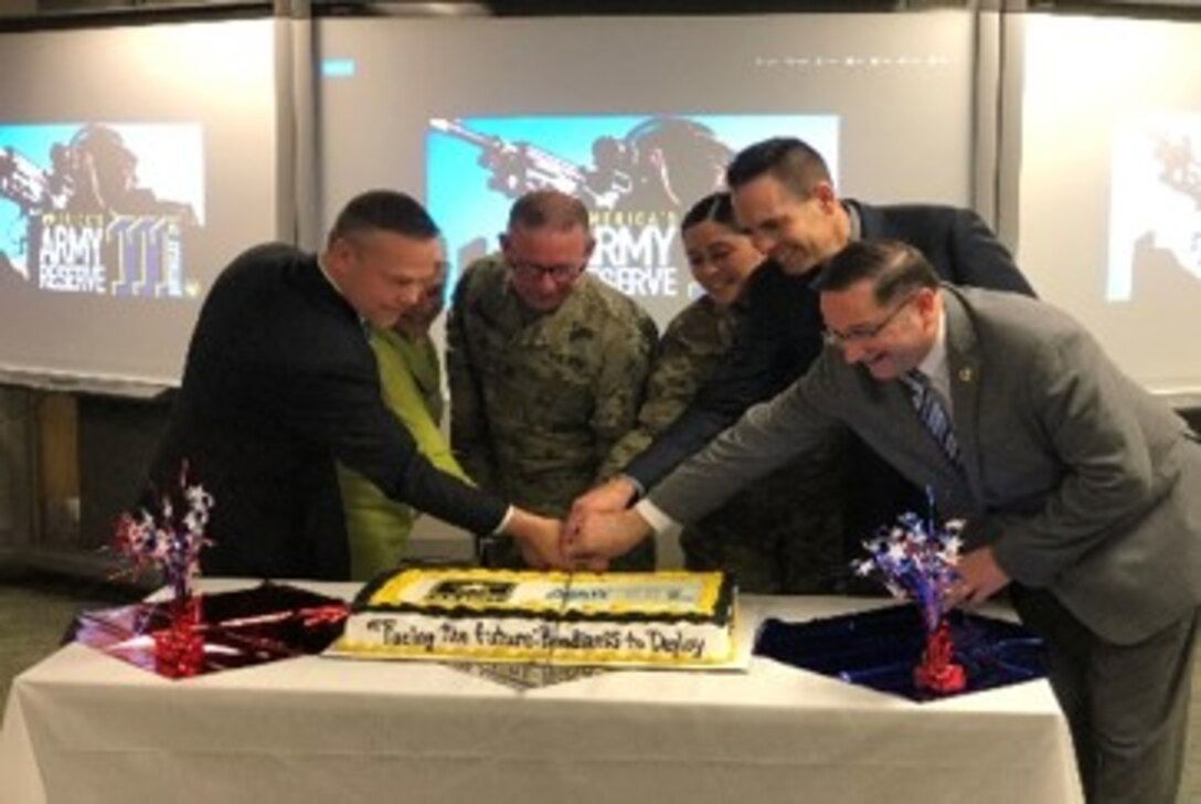 The 364th Sustainment Command (Expeditionary) hosted a cake-cutting ceremony in celebration of this year's Army Reserve birthday, where the youngest and most senior Soldiers were joined by the guests of honor, including Mr. Christopher Larsen, Military Liaison and Community Outreach and representative for Congressman Rick Larsen, the Hon. Jon Nehring, Mayor of the City of Marysville, and Mrs. Mary Miller, Army Reserve Ambassador for Washington State.