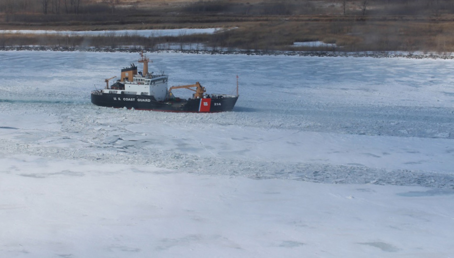 The crew of Coast Guard Cutter Hollyhock, a 225-foot sea-going buoy tender home-ported in Port Huron, Mich., breaks through the ice in the St. Clair River, Feb. 26, 2014. There are nine ice-breaking capable cutters home-ported in the Great Lakes region.