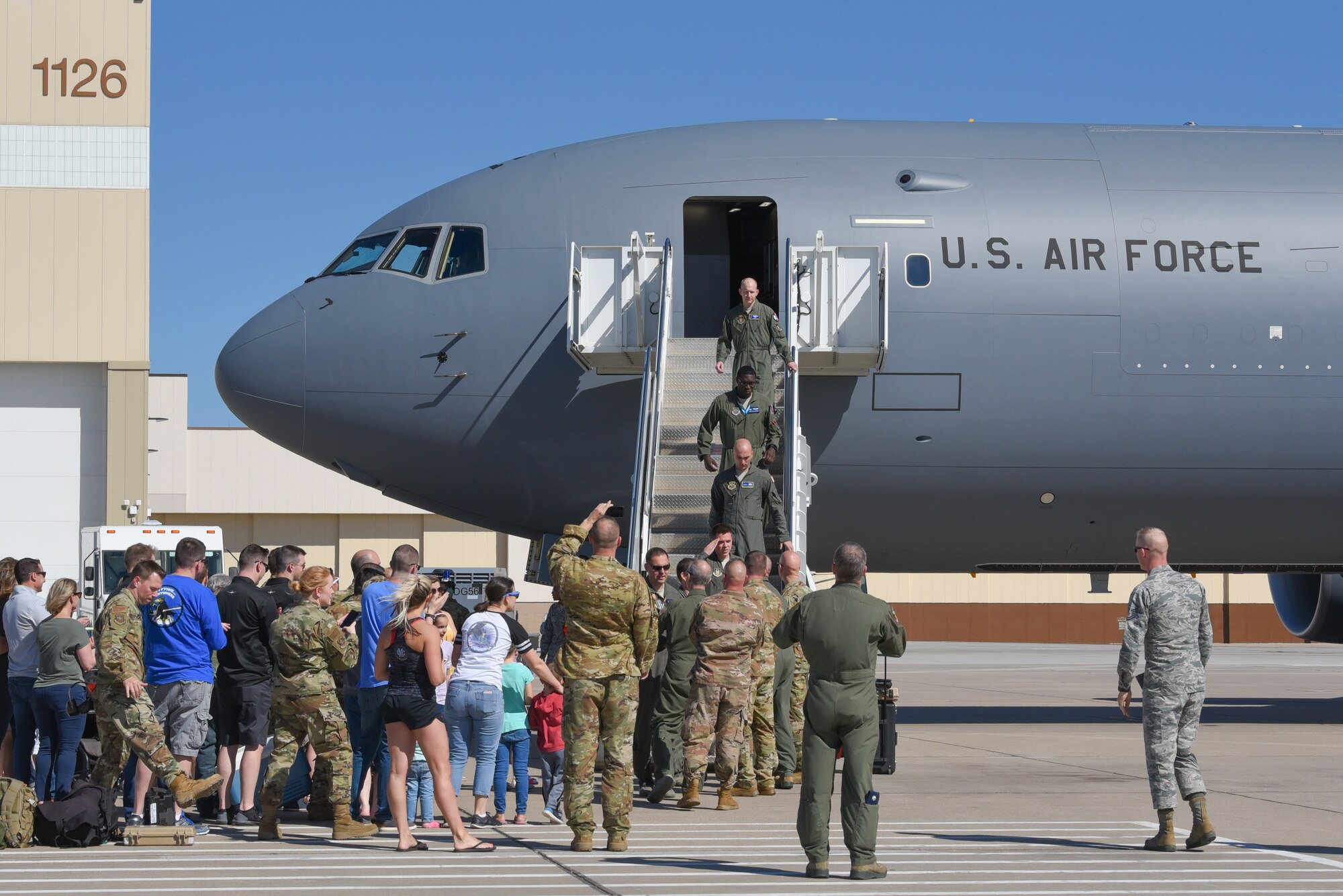 Members of Team McConnell exit a KC-46A Pegasus April 20, 2019, at McConnell Air Force Base, Kan. This is the fifth KC-46 to be delivered to McConnell. It is the first Pegasus delivery to have an aircrew composed of both active duty and reserve pilots from the 22nd and 931st Air Refueling Wings. (U.S. Air Force photo by Airman 1st Class Alexi Myrick)
