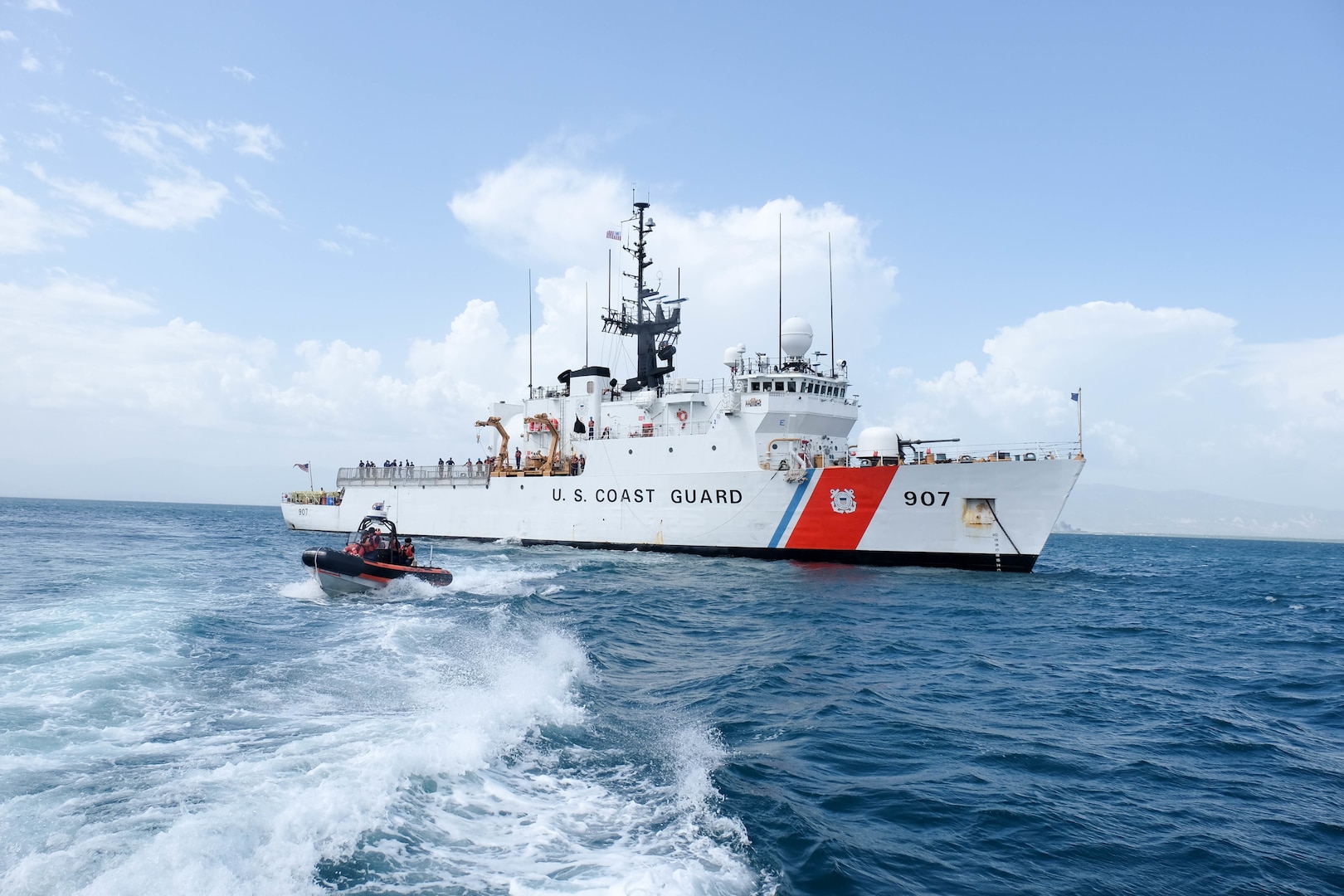 The Coast Guard Cutter Escanaba, a 270-foot medium endurance cutter homeported in Boston, and Escanaba’s small boat are underway for a personnel transfer offshore Haiti Wednesday, July 27, 2016. The cutter’s crew hosted Brian Shukan, deputy chief of mission at the U.S. Embassy in Haiti, and Michel-Ange Gedeon, director general of the Haitian National Police, for discussion of international search and rescue coordination and a tour of the cutter.