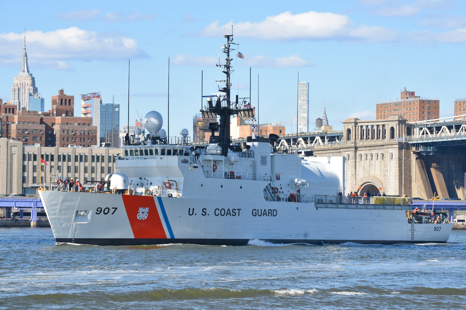 Coast Guard Cutter Escanaba transits southbound on the East River with the New York City skyline in the background on March 24, 2018. The Escanaba had just completed several months in dry dock at Brooklyn Naval Yard.