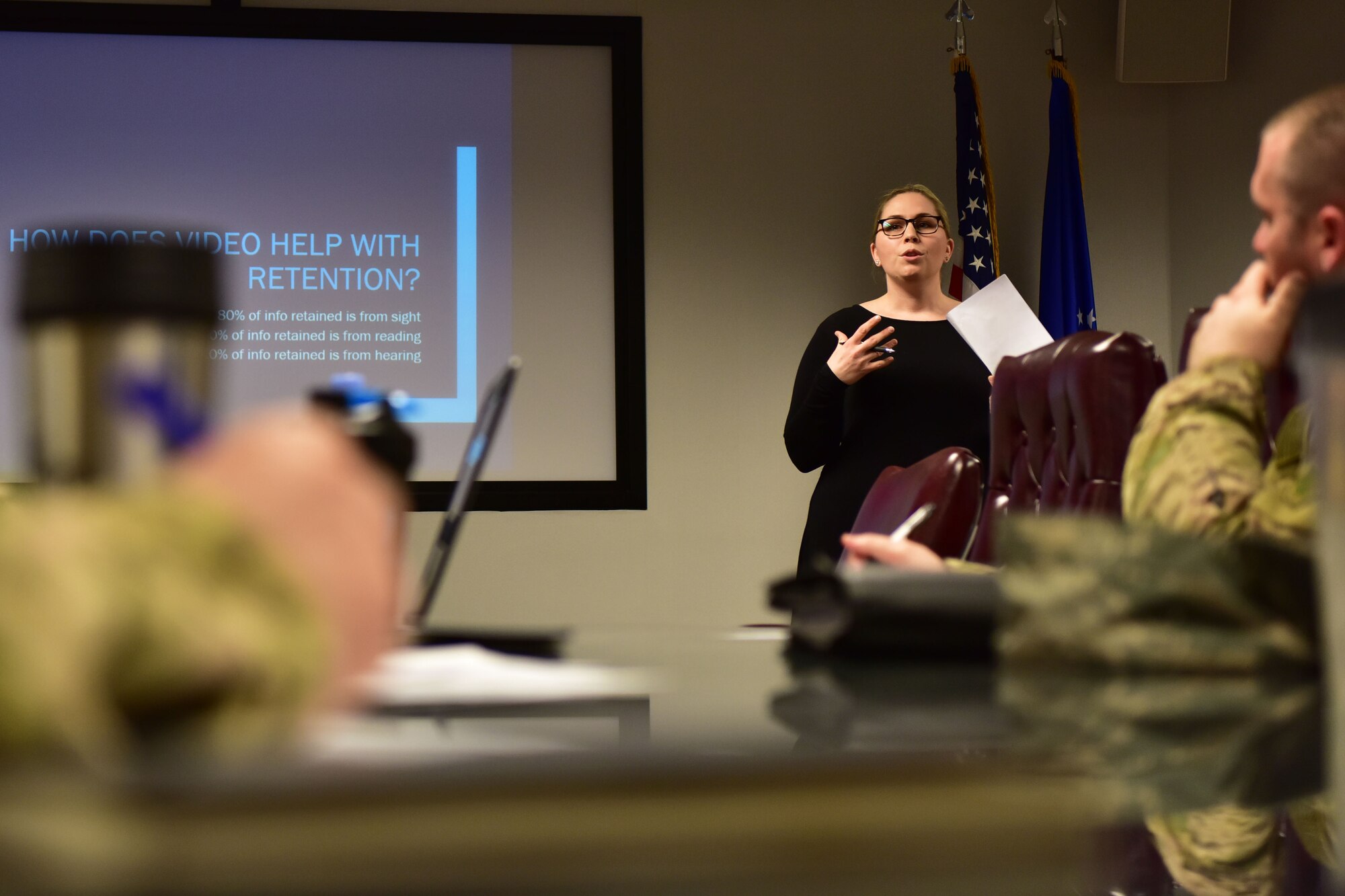 Civilian presents orientation video to panel of judges.