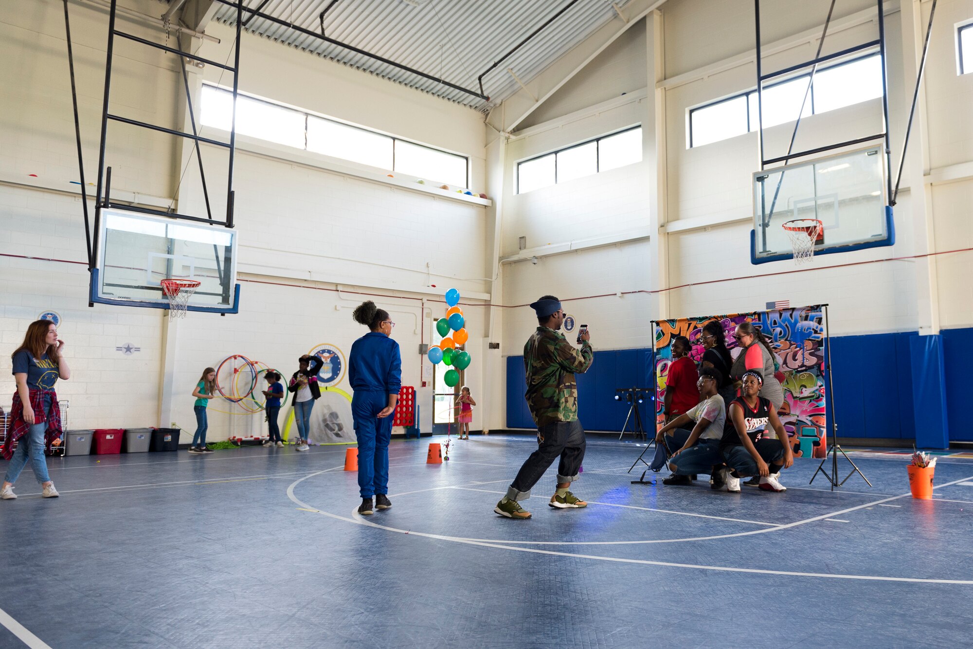 Participants pose for a photo during a youth dance party, April 12, 2019, at Moody Air Force Base, Ga. Team Moody showed its support for military children by hosting a number of events during Month of the Military Child in April. (U.S. Air Force photo by Airman 1st Class Hayden Legg)
