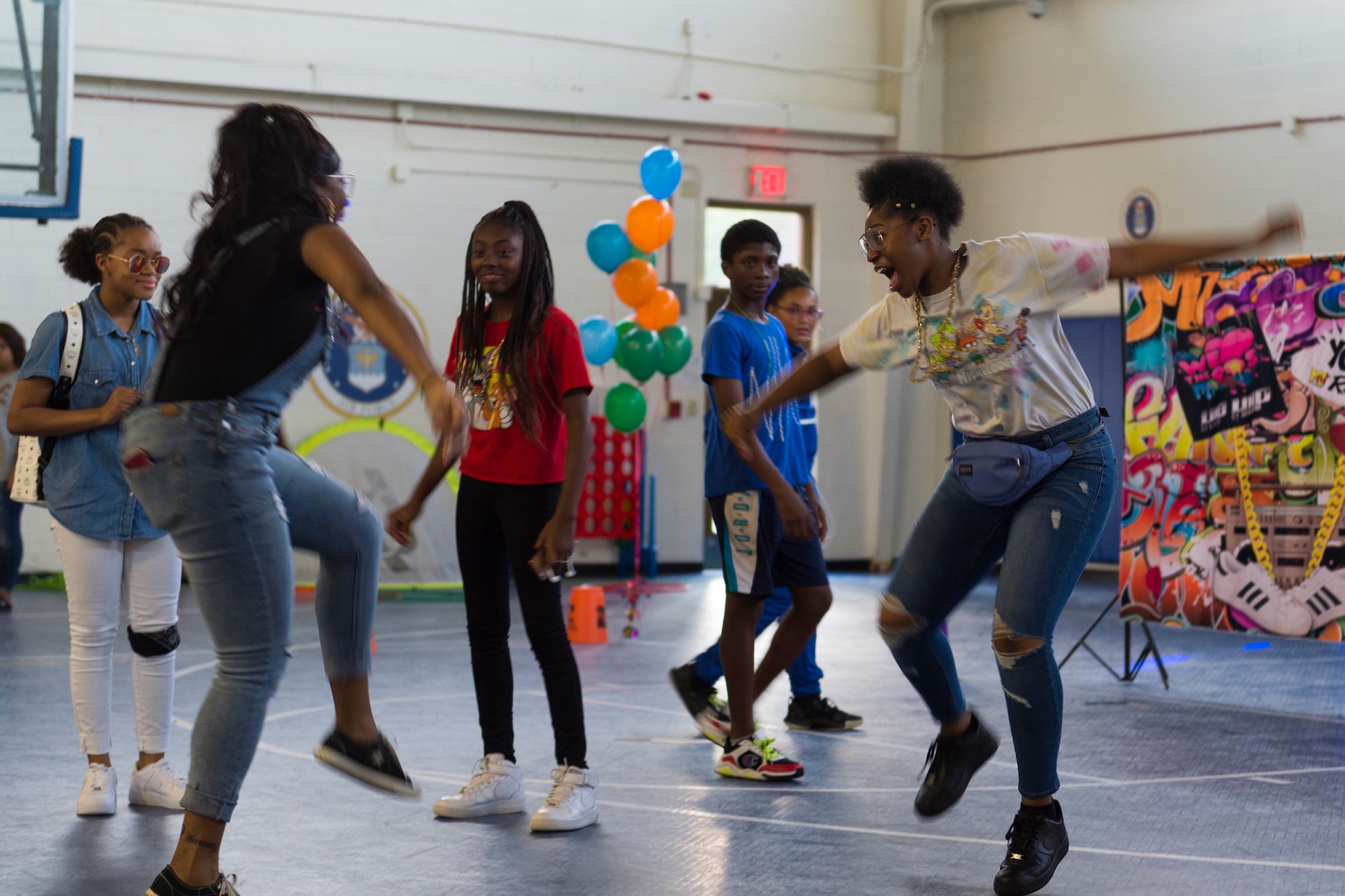 Participants dance during a youth dance party, April 12, 2019, at Moody Air Force Base, Ga. Team Moody showed its support for military children by hosting a number of events during Month of the Military Child in April. (U.S. Air Force photo by Airman 1st Class Hayden Legg)