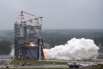 A test rocket engine fires at a testing facility