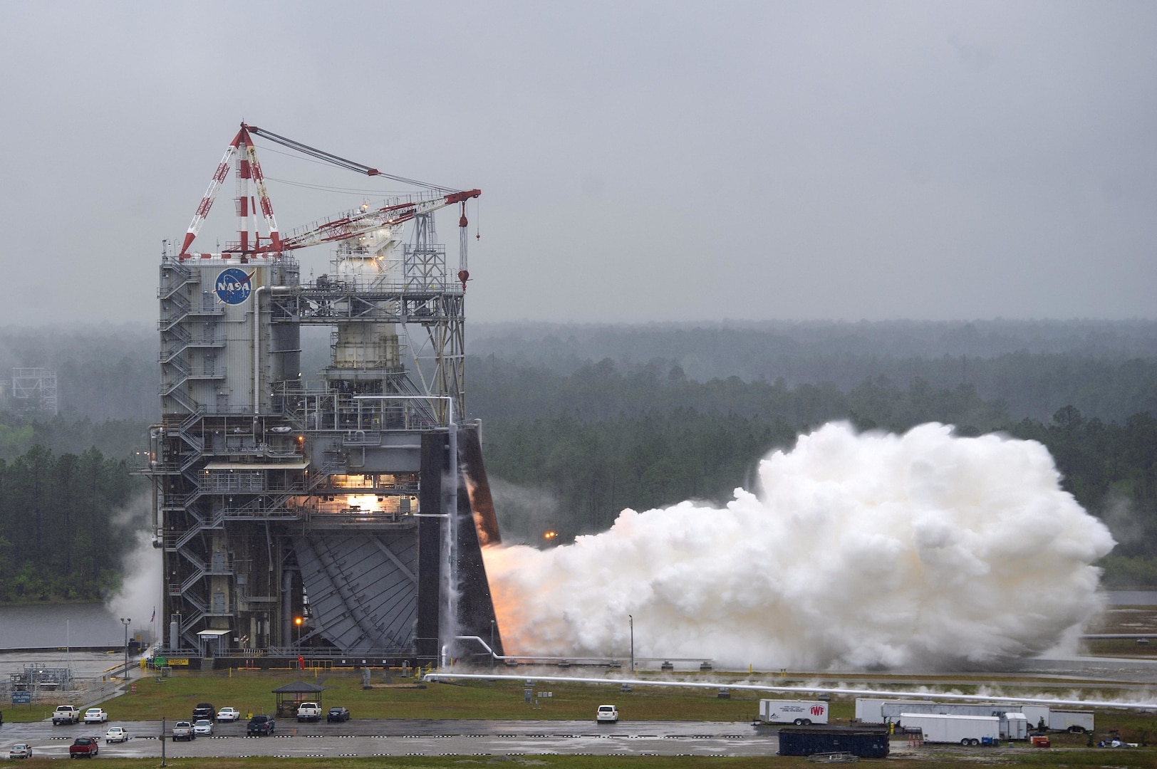 A test rocket engine fires at a testing facility