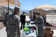 Staff Sgt. Alexis Johnson, Nellis Air Force Base Sexual Assault Prevention and Response volunteer victim advocate, shares information and promotional items with Airmen at Creech AFB, Nevada, April 23, 2019. Because April is Sexual Assault Awareness and Prevention and Child Abuse Prevention Month, helping agencies from Creech and Nellis spent the day informing Airmen and families about what programs are available to raise awareness and help victims of sexual assault and child abuse. (U.S. Air Force photo by Master Sgt. Dillon White)