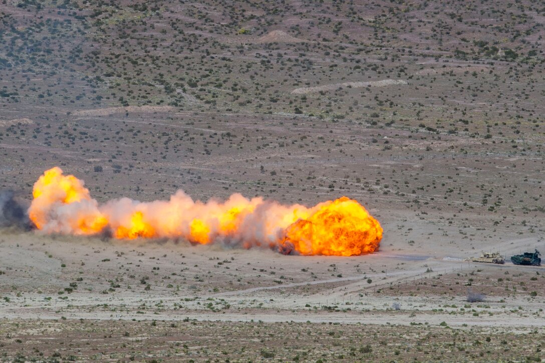 An explosion clears a path through a minefield.