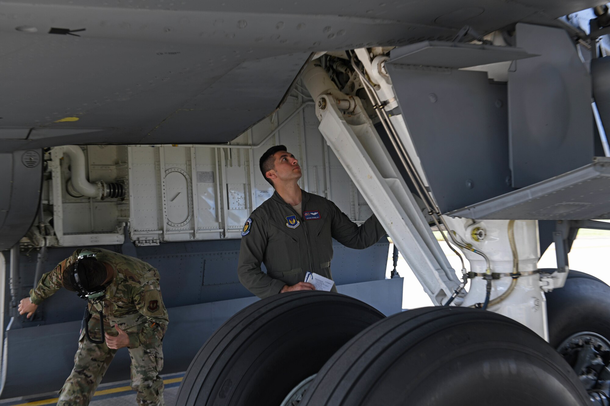 U.S. Air Force Capt. Jason Douglas, 351st Air Refueling Squadron pilot, looks over landing gear while performing a walk-around of a 351st ARS KC-135 Stratotanker prior to take-off during the “FURIOUS 48” readiness exercise at RAF Mildenhall, England, April 24, 2019. Exercise scenarios were designed to ensure 100th ARW Airmen were fully prepared for potential contingencies in the wing’s area of responsibility. (U.S. Air Force photo by Senior Airman Luke Milano)