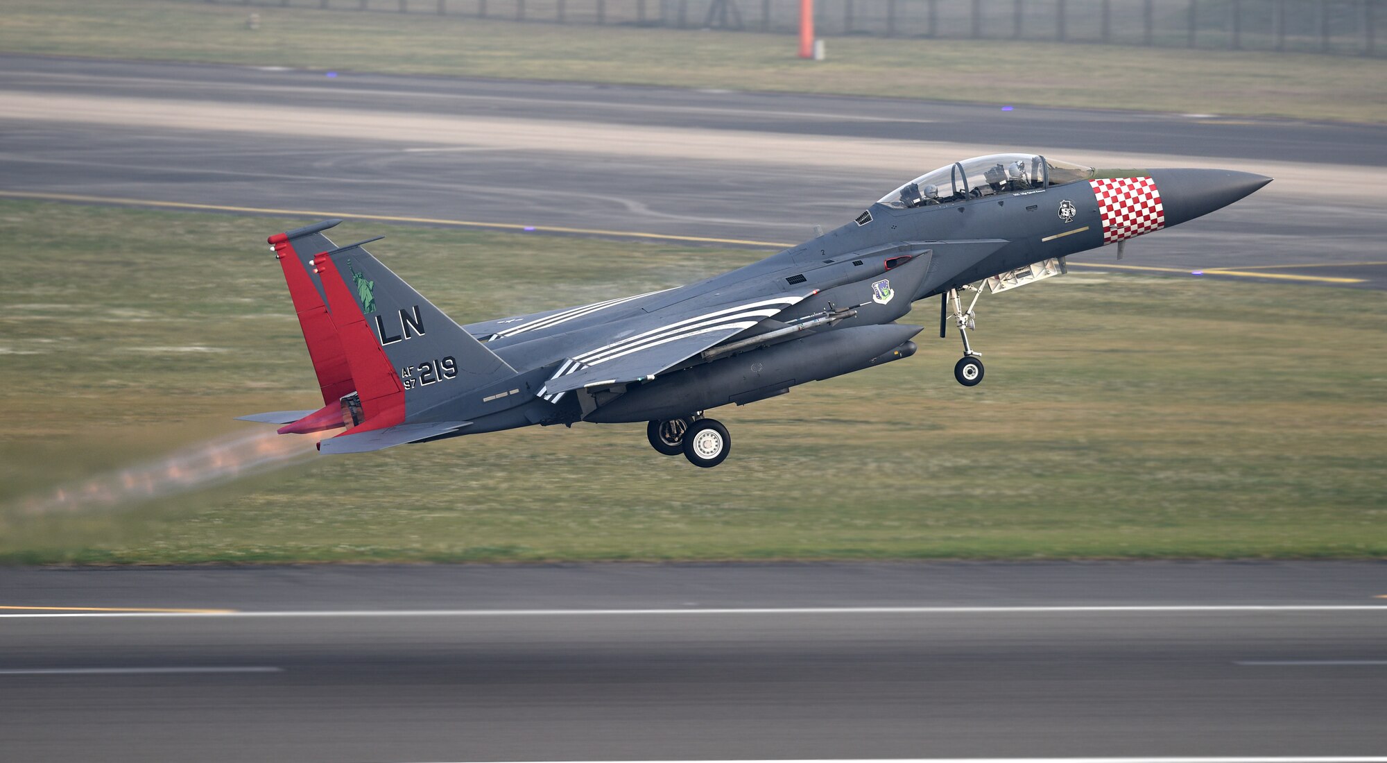 An F-15E Strike Eagle painted in the 492nd Fighter Squadron’s heritage colors, inspired by its P-47 Thunderbolt predecessor, takes off from the flight line at Royal Air Force Lakenheath, England, April 24, 2019. The 48th Fighter Wing is participating in a readiness exercise from 23-25 April focused on continuous operations over a 48-hour period. (U.S. Air Force photo by Airman 1st Class Madeline Herzog)