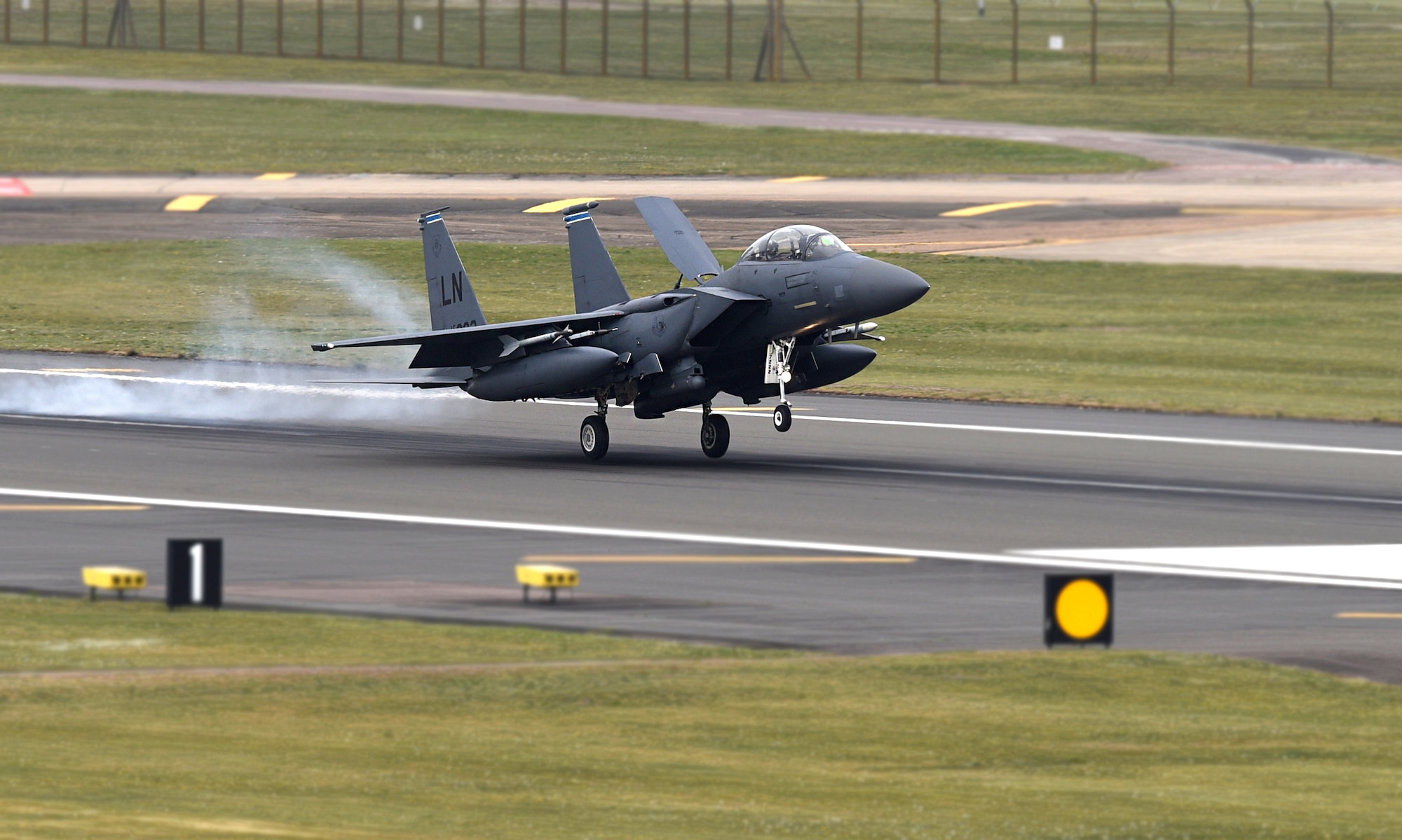 An F-15E Strike Eagle assigned to the 492nd Fighter Squadron lands on the flight line at Royal Air Force Lakenheath, England, April 23, 2019. The 48th Fighter Wing is participating in a readiness exercise from 23-25 April focused on continuous operations over a 48-hour period. (U.S. Air Force photo by Airman 1st Class Madeline Herzog)