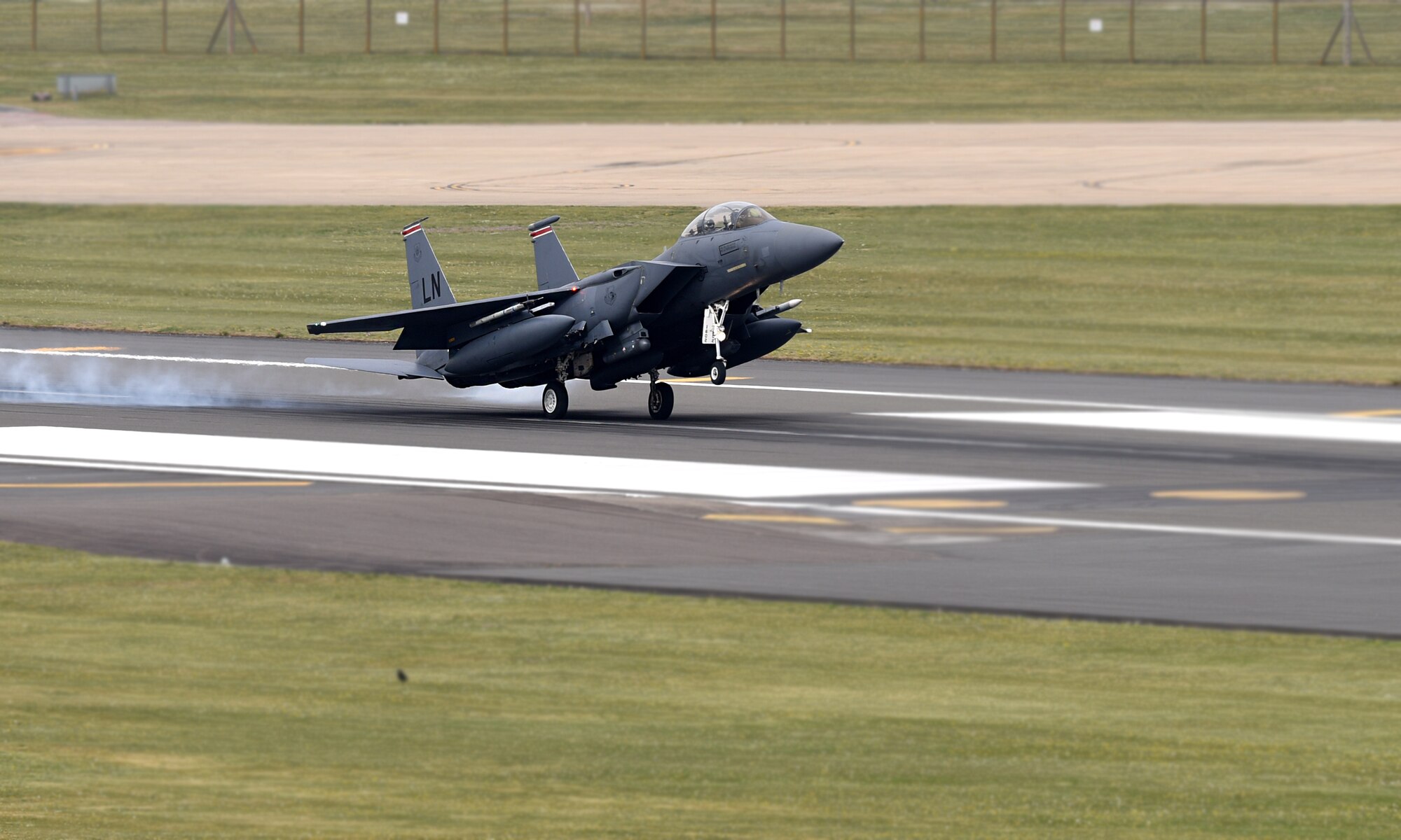 An F-15E Strike Eagle assigned to the 494th Fighter Squadron lands on the flight line at Royal Air Force Lakenheath, England, April 23, 2019. The 48th Fighter Wing is participating in a readiness exercise from 23-25 April focused on continuous operations over a 48-hour period. (U.S. Air Force photo by Airman 1st Class Madeline Herzog)