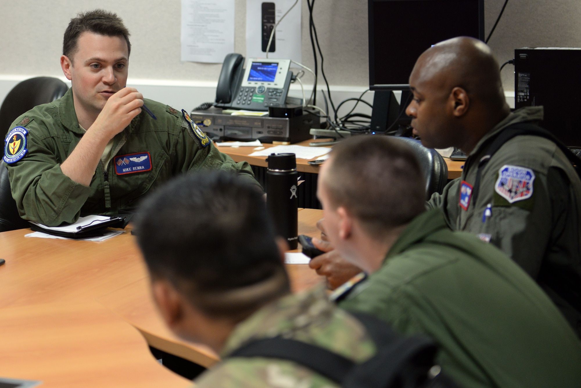 U.S. Air Force Maj. Mike Renna, 351st Air Refueling Squadron aircraft commander, coordinates with another aircrew about their refueling mission at RAF Mildenhall, England, April 24, 2019. During Mission Assurance Exercise 19-01, the 351st ARS generated over 30 sorties during a 48-hour period. (U.S. Air Force photo by Senior Airman Benjamin Cooper)