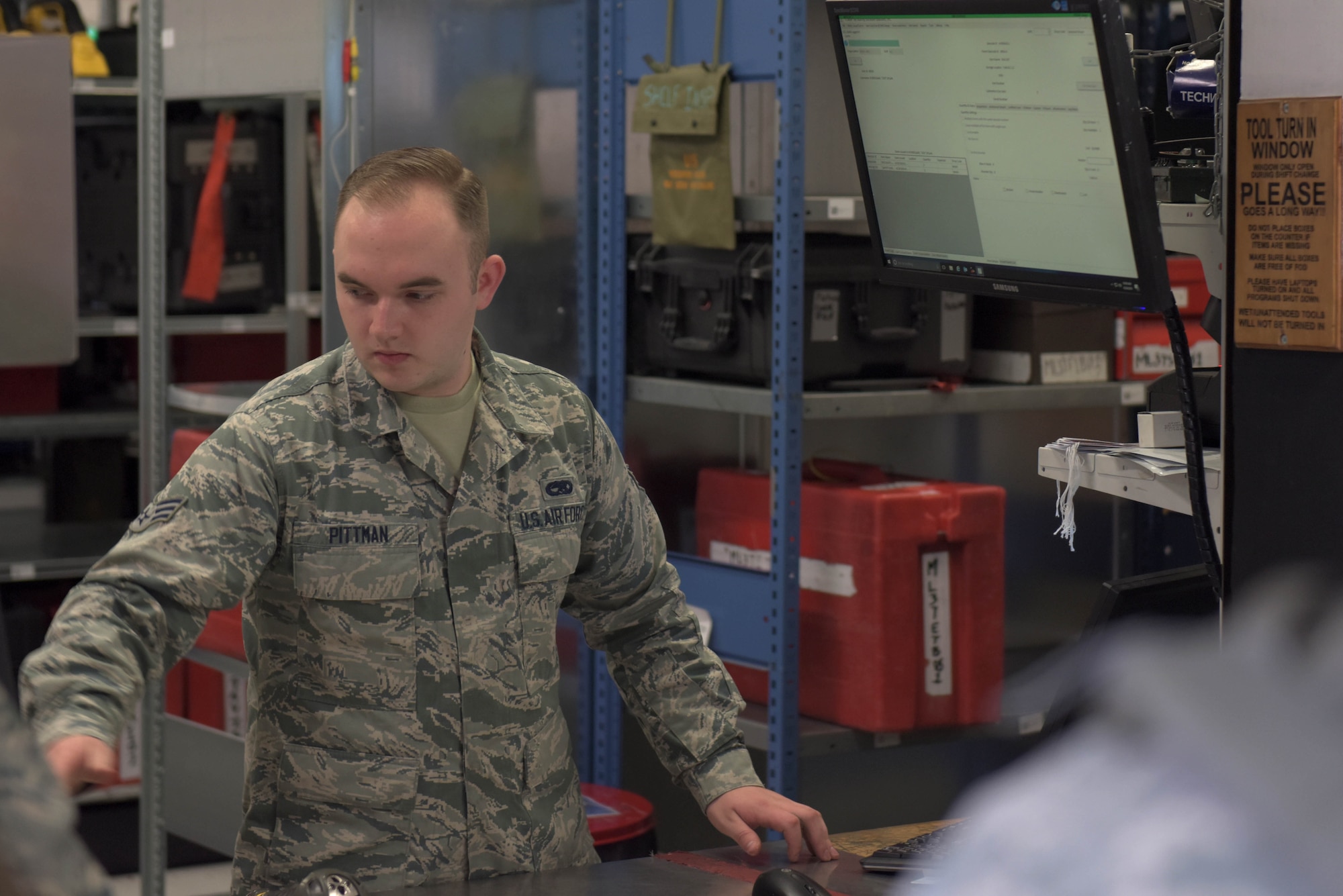 U.S. Air Force Senior Airman Christopher Pittman, 100th Aircraft Maintenance Squadron consolidated tool kit custodian, checks out tools to Airmen prior to the start of their shift at RAF Mildenhall, England, April 24, 2019. During Mission Assurance Exercise 19-01, the 100th AMXS worked to produce over 32 aircraft for sorties during a 48-hour period. (U.S. Air Force photo by Senior Airman Benjamin Cooper)