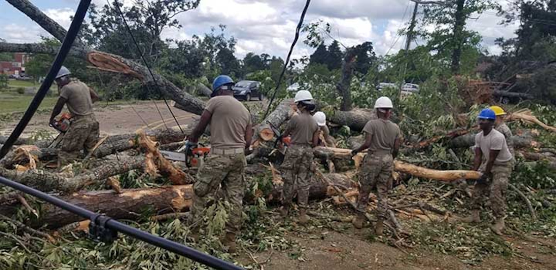 Louisiana National Guard members with the 527th Engineer Battalion, headquartered in Ruston, Louisiana, clean debris after tornados touched down in their community, April 25, 2019.