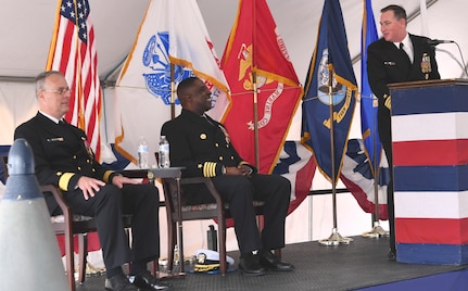 IMAGE: DAHLGREN, Va. (April 24, 2019) - Capt. (sel) Stephen ‘Casey’ Plew, right, commanding officer of the Naval Surface Warfare Center Dahlgren Division (NSWCDD), shares a light moment during his assumption of command remarks with Capt. Godfrey Weekes, outgoing NSWCDD commanding officer, middle, and Rear. Adm. Eric Ver Hage, commander of the Naval Sea Systems Command (NAVSEA) Warfare Centers, during a change of command ceremony.