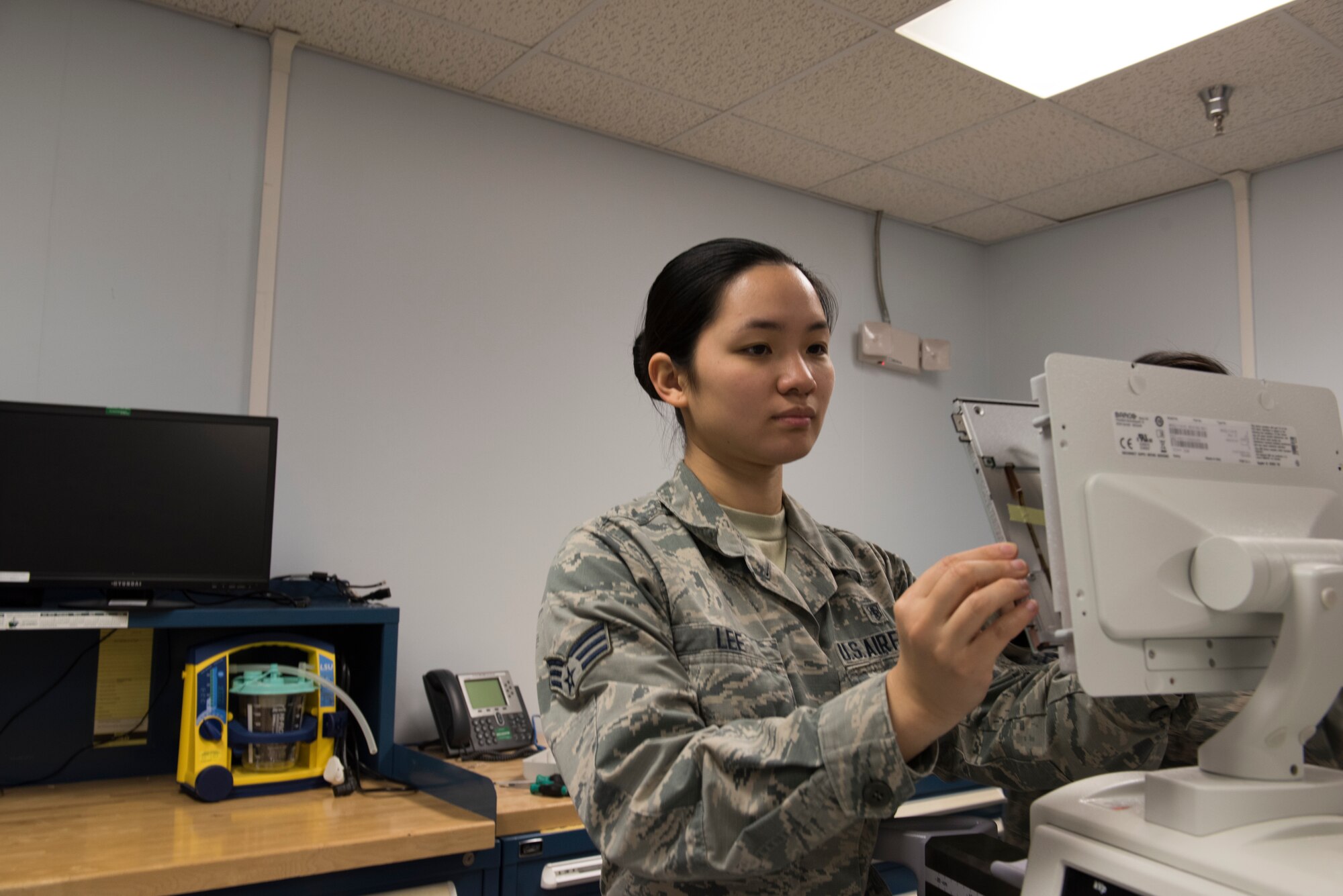 Senior Airman Kirsten Lee, 39th Medical Support Squadron biomedical equipment technician, replaces a screen March 29, 2019, at Incirlik Air Base, Turkey.