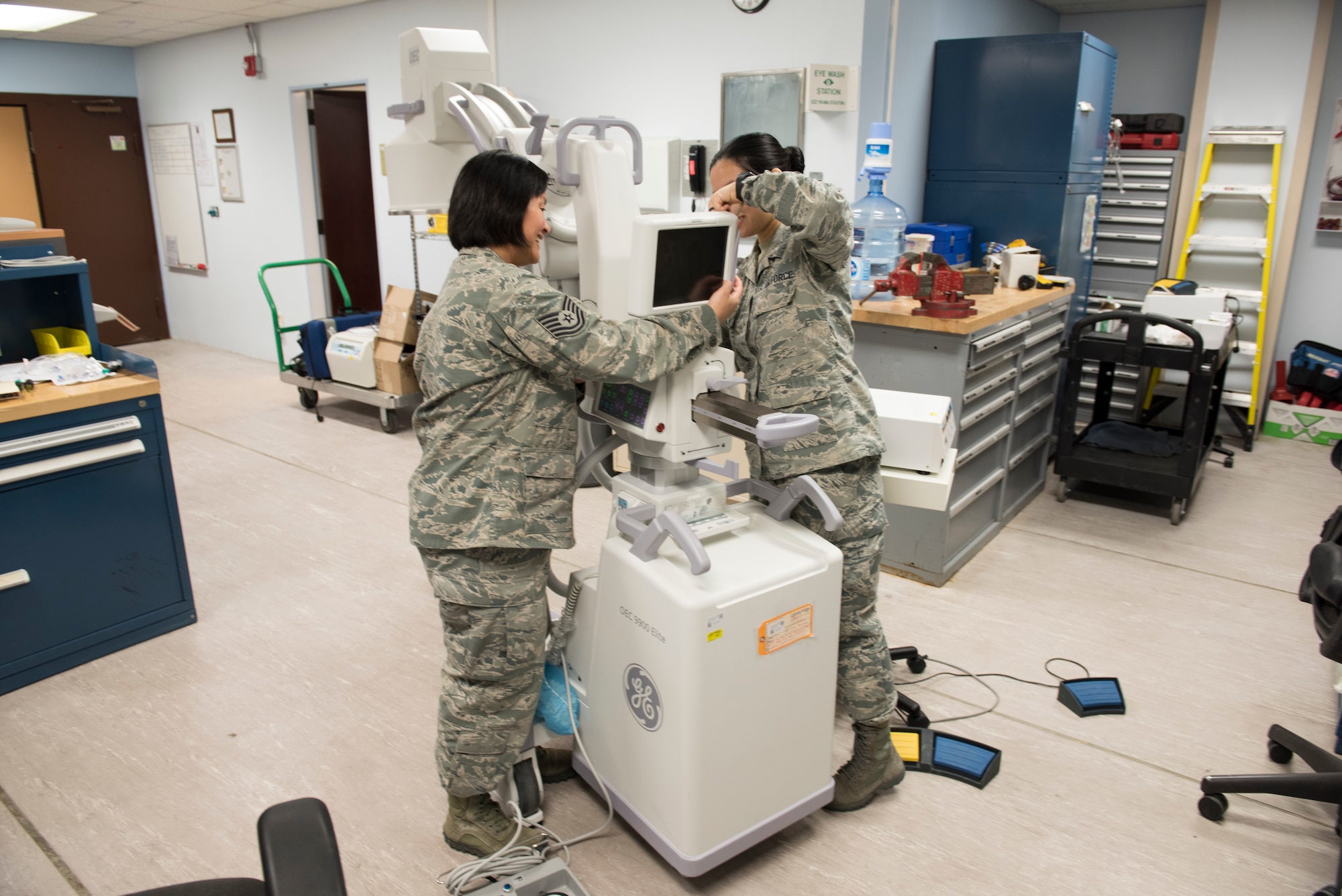 ech. Sgt. Kristine Richardson, 39th Medical Support Squadron biomedical equipment NCO in charge, left, and Senior Airman Kirsten Lee, 39th MDSS biomedical equipment technician, fix an X-ray machine March 29, 2019, at Incirlik Air Base, Turkey.